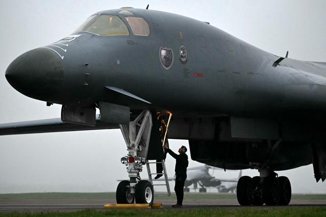 Ground crew enter a US Air Force B-1 Lancer bomber after it arrives at RAF Fairford in south west England shortly after sunrise on March 7, 2026. 