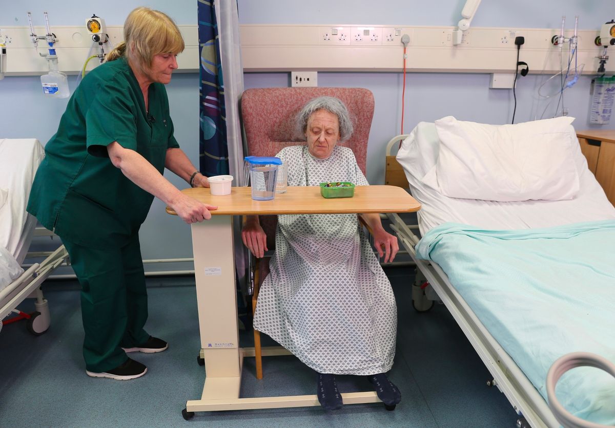 Attached table tops are used to keep frail dementia patients in a chair