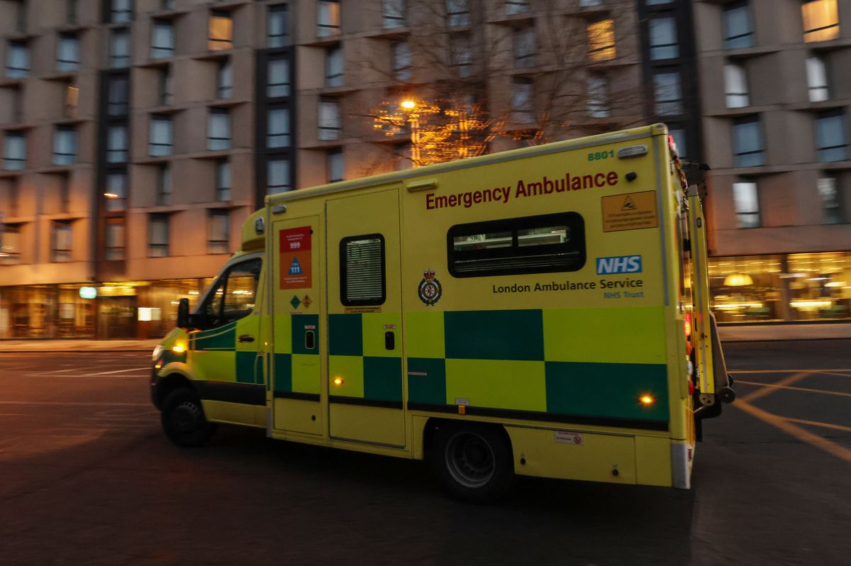 An ambulance departs the London Ambulance Service headquarters in the Waterloo district of London