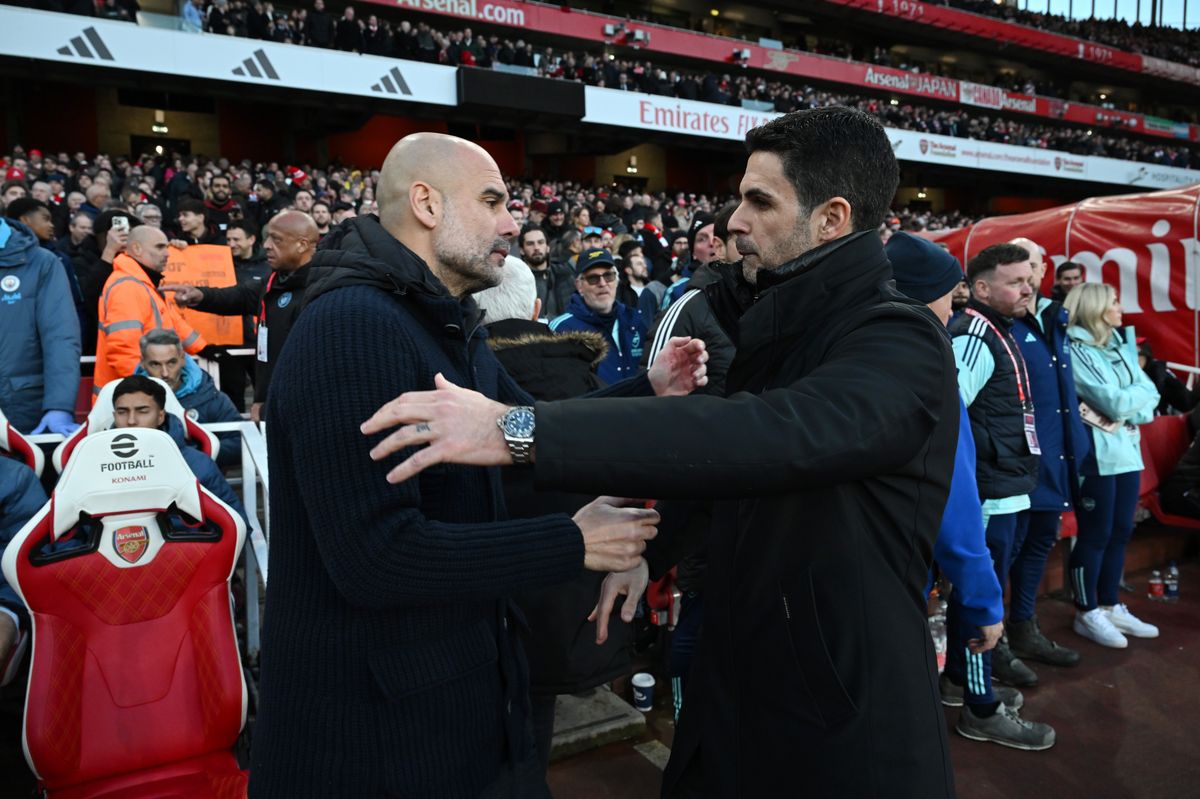 Pep Guardiola, Manager of Manchester City, embraces Mikel Arteta, Manager of Arsenal, prior to the Premier League match between Arsenal FC and Manchester City FC at Emirates Stadium