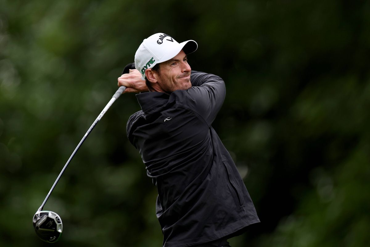 Andy Murray swings a golf club