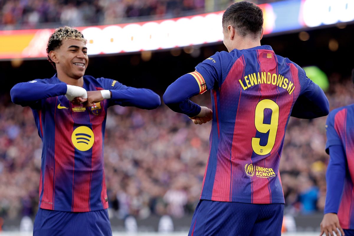 Robert Lewandowski of FC Barcelona celebrates the 1-0 with Lamine Yamal of FC Barcelona  during the LaLiga EA Sports  match between FC Barcelona v Athletic de Bilbao at the Lluis Companys Olympic Stadium