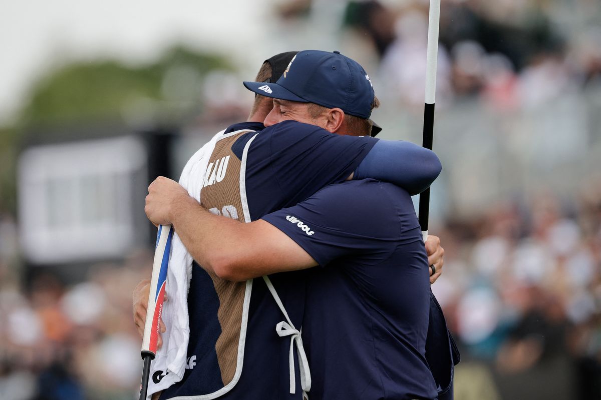 Crushers GC's US player Bryson Dechambeau (R) hugs his caddie after winning the playoff and the LIV Gold South Africa tournament on the fourth day of the LIV Golf South Africa tournament at The Club in Steyn City on March 22, 2026. 