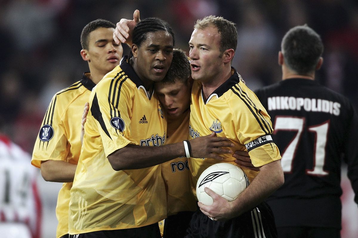 Newcastle strikers Patrick Kluivert, James Milner and Alan Shearer celebrate after Kluivert scored the third goal during the UEFA Cup, round of 16, First leg match between Olympiakos and Newcastle United