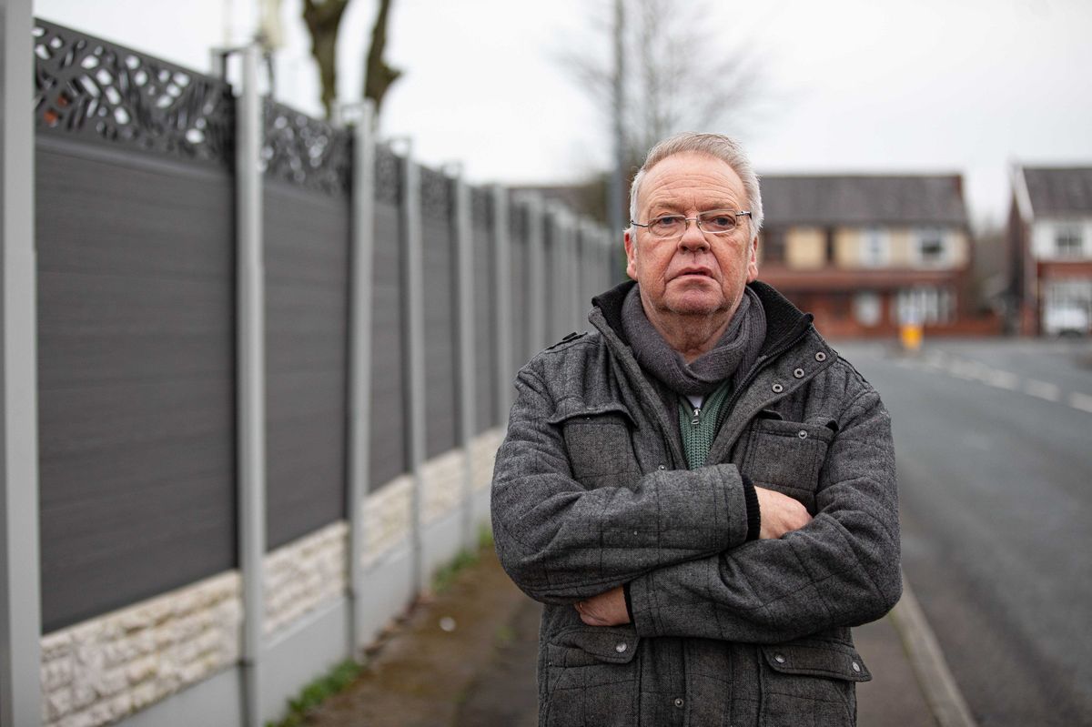 An elderly couple have blasted council bosses after being ordered to rip down a 6 ft tall fence built to stop people nosing into their house. David Hopwood, and his wife Denise, erected the grey composite fence in front of their Home in Farnworth, Bolton, Gtr Manchester, to provide privacy and security. March 9, 2026. // A retired couple have hit out at council chiefs who have ordered them them to rip down a £4,500 seven foot high fence - because of its colour. David and Denise Hopwood erected the 25 metre long, grey composite fence around their home after ripping up an old, nine-foot-high hedge that they were finding difficult to maintain. However a neighbour complained about its height forcing David, 67, and Denise, 66, to see retrospective planning permission. This week the couple, from Bolton, Gtr Manchester, were told permission had been refused because it was' out of touch with the character and appearance of the surrounding area.' The couple hit back saying that the hedge had become 'too difficult to maintain' at their age and was costing £800 a year to look after.