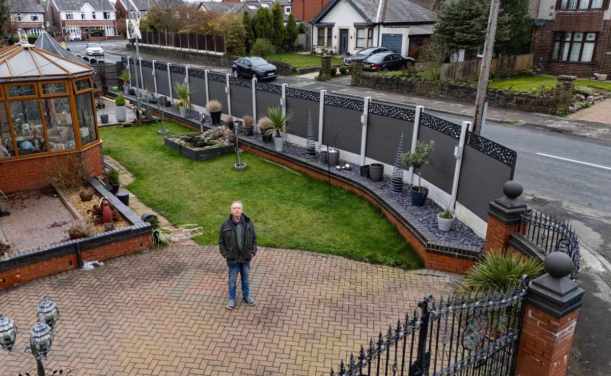 An elderly couple have blasted council bosses after being ordered to rip down a 6 ft tall fence built to stop people nosing into their house. David Hopwood, and his wife Denise, erected the grey composite fence in front of their Home in Farnworth, Bolton, Gtr Manchester, to provide privacy and security. March 9, 2026. // A retired couple have hit out at council chiefs who have ordered them them to rip down a £4,500 seven foot high fence - because of its colour. David and Denise Hopwood erected the 25 metre long, grey composite fence around their home after ripping up an old, nine-foot-high hedge that they were finding difficult to maintain. However a neighbour complained about its height forcing David, 67, and Denise, 66, to see retrospective planning permission. This week the couple, from Bolton, Gtr Manchester, were told permission had been refused because it was' out of touch with the character and appearance of the surrounding area.' The couple hit back saying that the hedge had become 'too difficult to maintain' at their age and was costing £800 a year to look after.