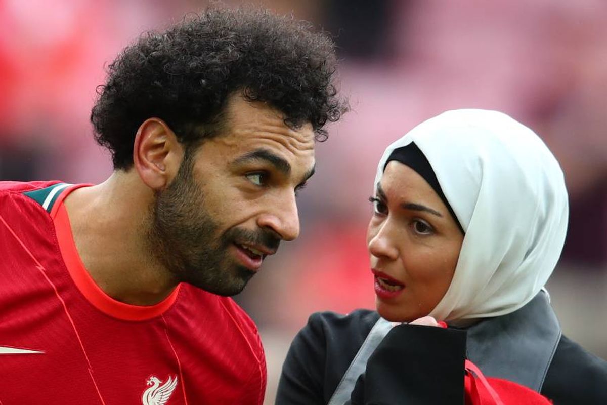 Mohamed Salah of Liverpool looks on with his wife Magi at the end of the Premier League match between Liverpool and Wolverhampton Wanderers at Anfield on May 22, 2022 in Liverpool, United Kingdom