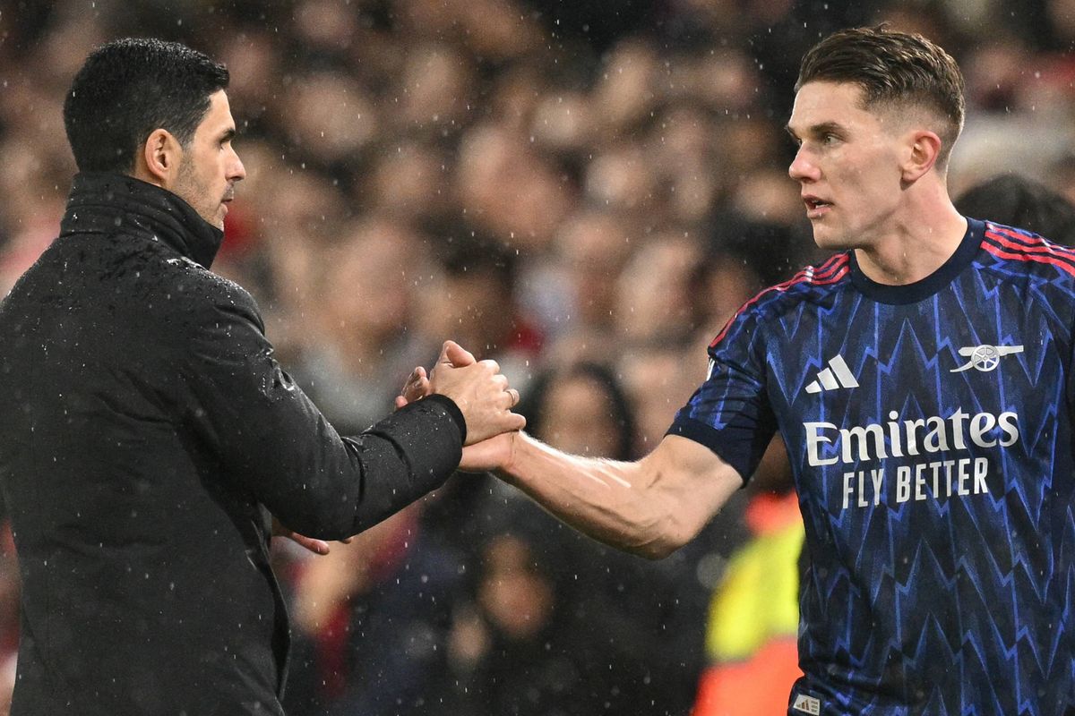 Arsenal's Swedish striker #14 Viktor Gyokeres (R) shakes hands with Arsenal's Spanish manager Mikel Arteta (L) as he is substituted during the English Premier League football match between Leeds United and Arsenal at Elland Road in Leeds, northern England on January 31, 2026.