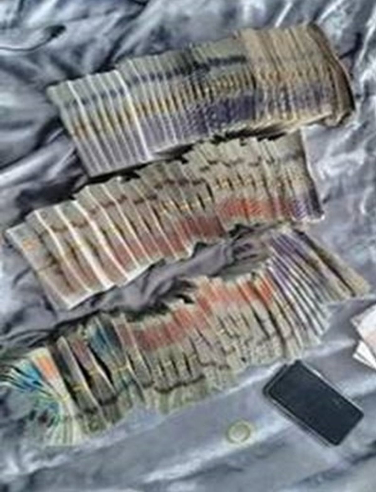 Photos shared between Steven Nicholls and Dean Deary's gang of the cash they were making dealing cocaine and heroin.