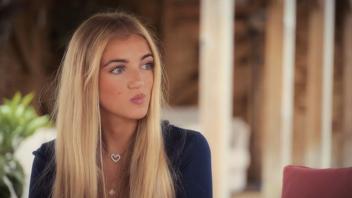 princess andre staring into distance in black top