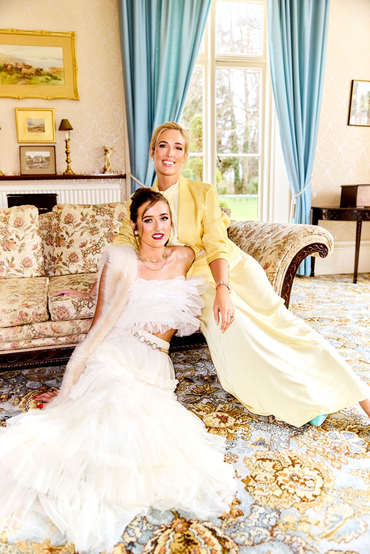 paris and venezuela sat down in fancy living room