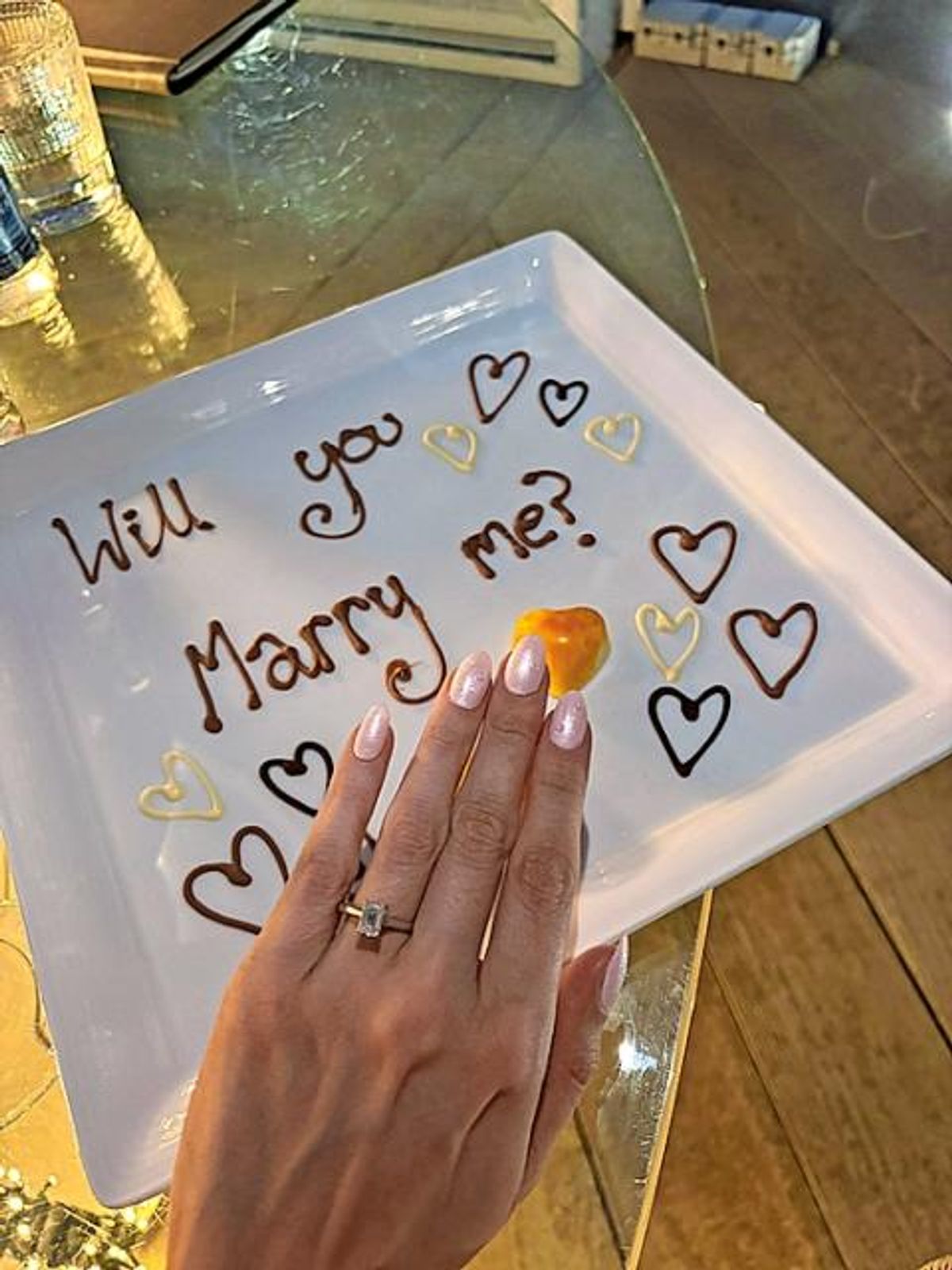 Craig Johnston proposed during a dinner he arranged. 