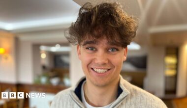 A man with brown hair, smiling