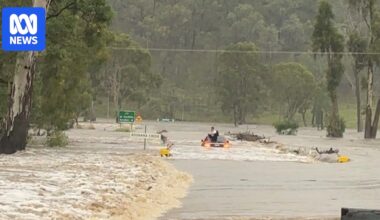Man stuck on car roof, woman rescued as most of Queensland remains on flood alert