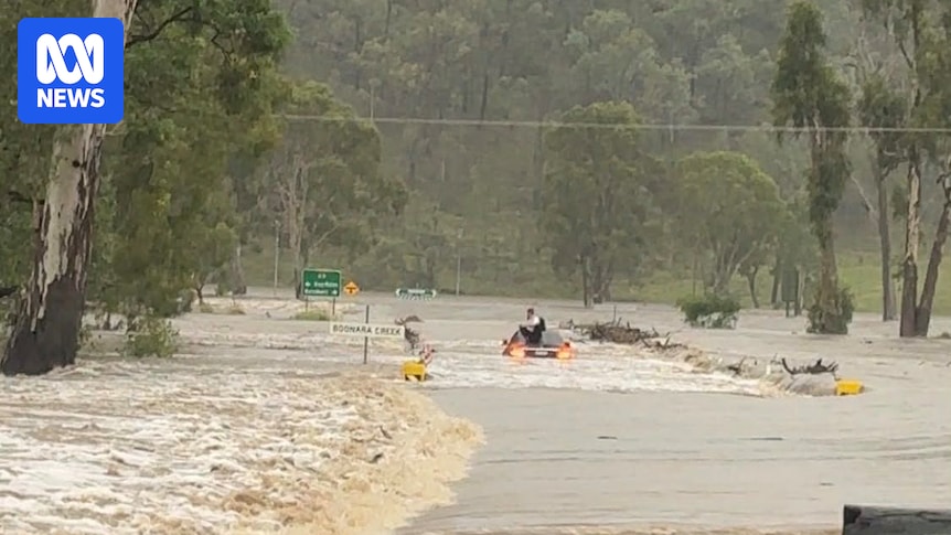 Man stuck on car roof, woman rescued as most of Queensland remains on flood alert