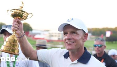 Luke Donald holds aloft the Ryder Cup trophy at Bethpage Black in 2025