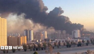 Israel says it hits security headquarters across Tehran, as Iran attacks US sites in Dubai and Qatar