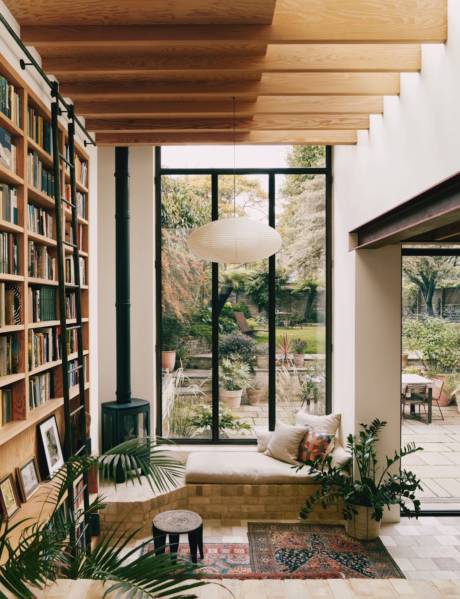 Image may contain Window Indoors Interior Design Bay Window Plant Chair and Furniture