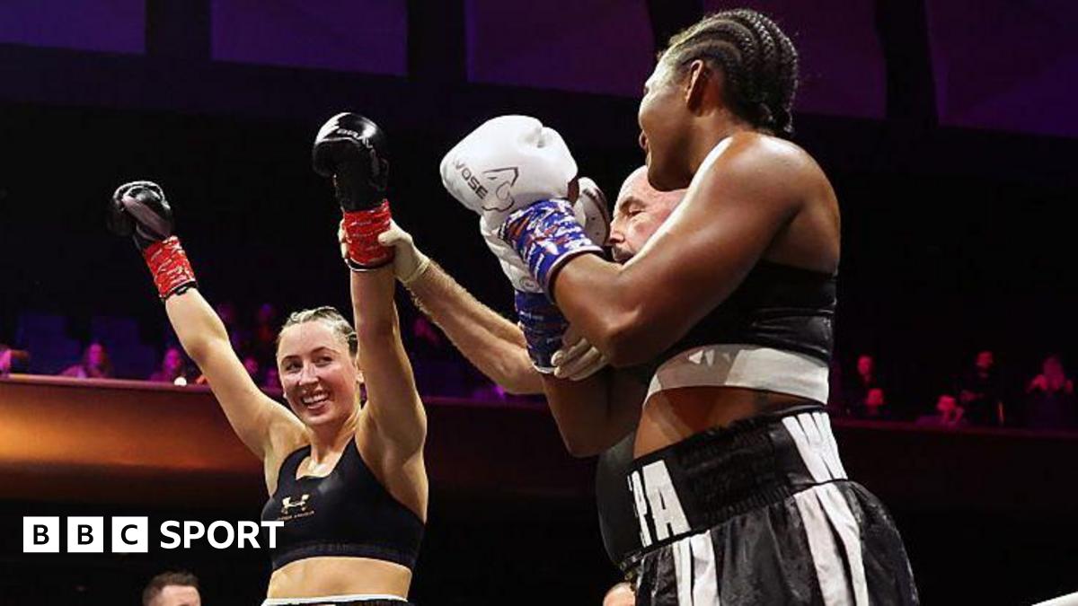 Jade Jones' arm is lifted as the winner of the boxing bout against Egypt Criss