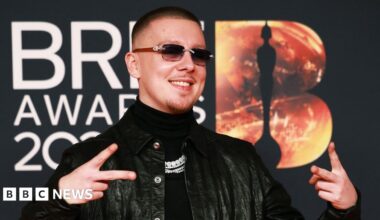 Aitch poses on the red carpet during for the Brit Awards at the Co-op Live Arena in Manchester last month