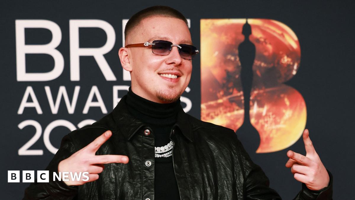 Aitch poses on the red carpet during for the Brit Awards at the Co-op Live Arena in Manchester last month