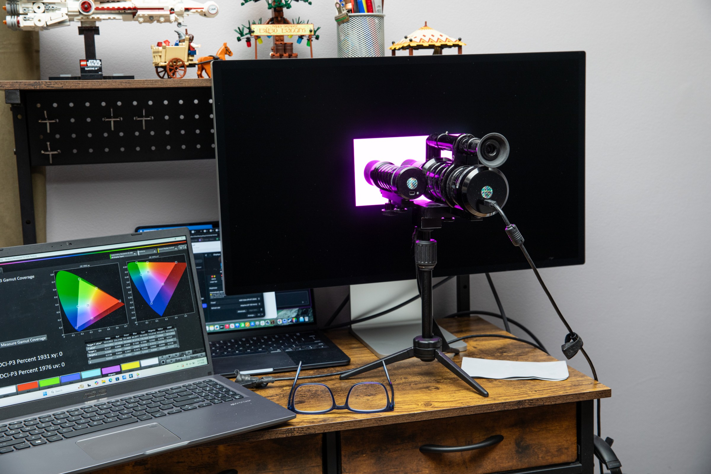 A Colorimetry Research CR-300 spectroradiometer measuring a test pattern on the Apple Studio Display XDR.