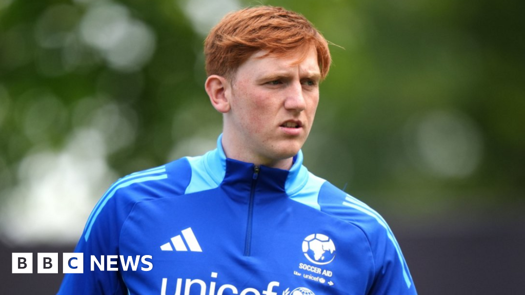 Angry Ginge  in a UNICEF football training top