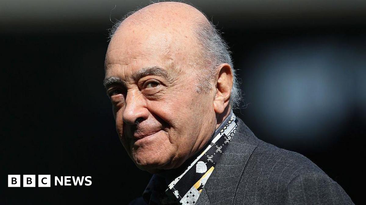 Mohamed Al Fayed is pictured at a football match wearing a grey suit jacket and a patterned black, grey and yellow shirt. He is balding with grey hair to the sides. At the time he was the Fulham chairman and is pictured ahead of the Barclays Premier League match between Fulham and Wolverhampton Wanderers at Craven Cottage on April 17, 2010 in London.