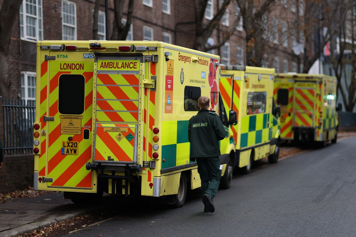 A paramedic walks to an ambulance parked near the London Ambulance Service headquarters in the Waterloo district of London, UK, on Wednesday, Dec. 21, 2022. Ambulance workers are demanding a higher pay rise to cope with the UKs cost of living crisis. Photographer: Hollie Adams/Bloomberg via Getty Images