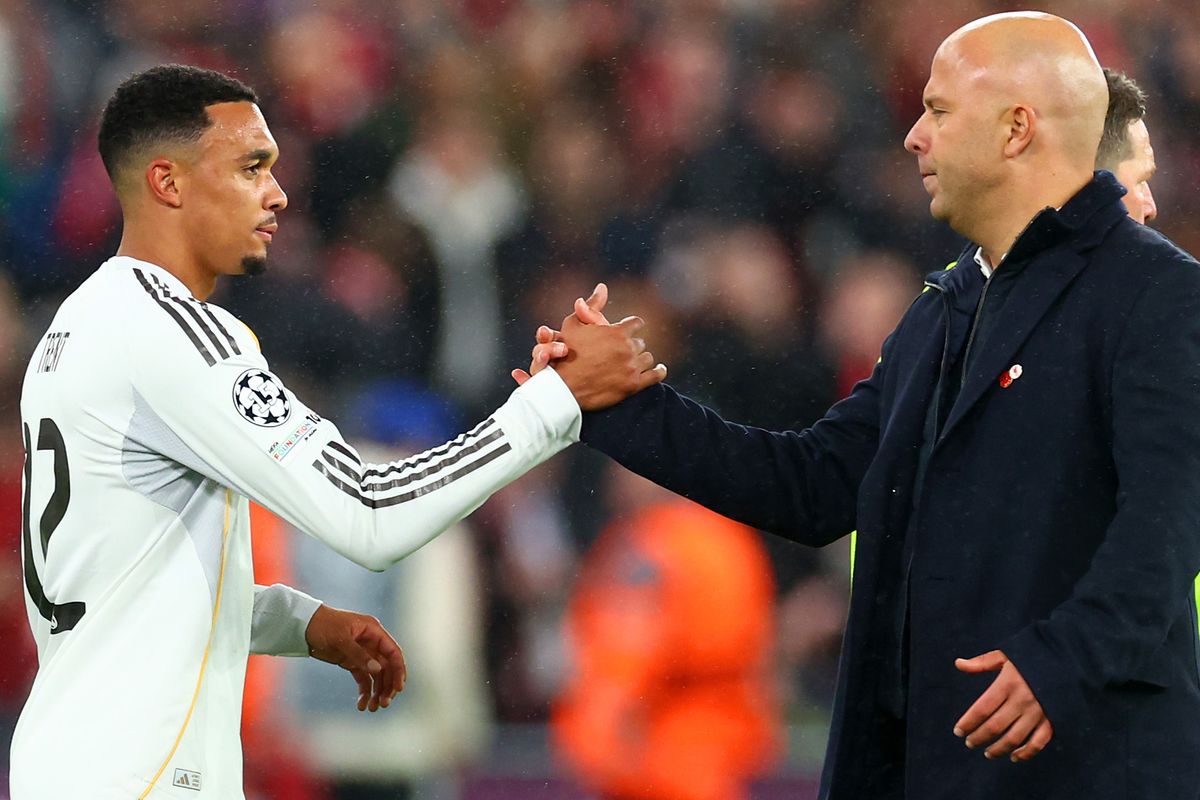 Trent Alexander-Arnold of Real Madrid shakes hands with Liverpool manager Arne Slot 