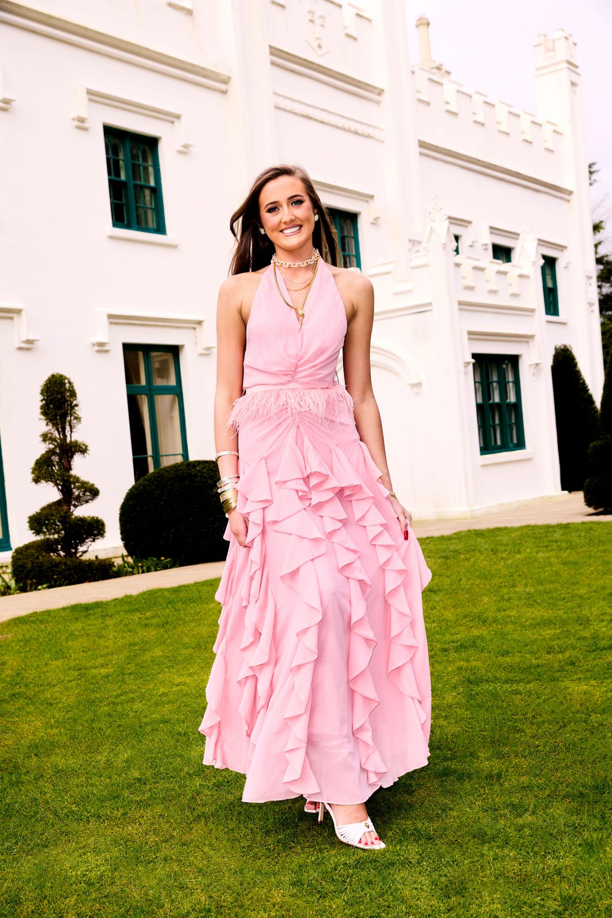 venezuela fury in pink dress outside white mansion on lawn