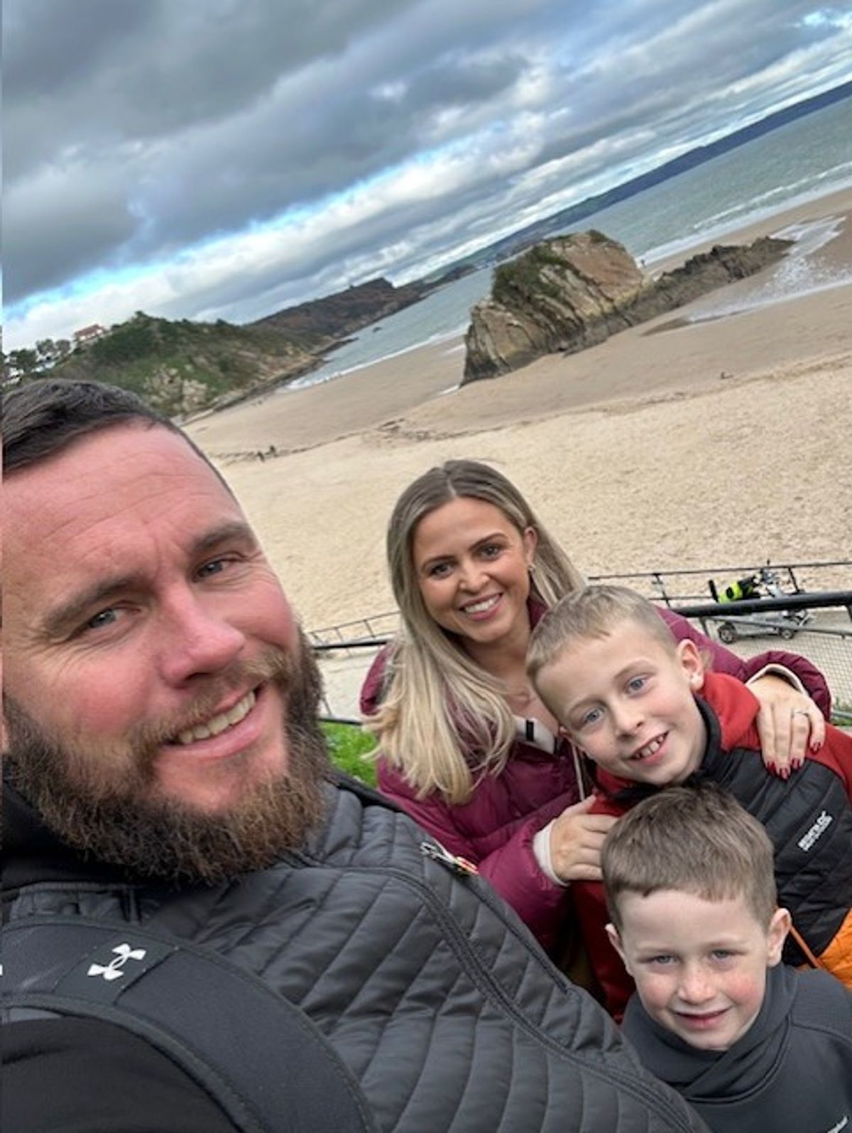 A man, a woman and two little boys