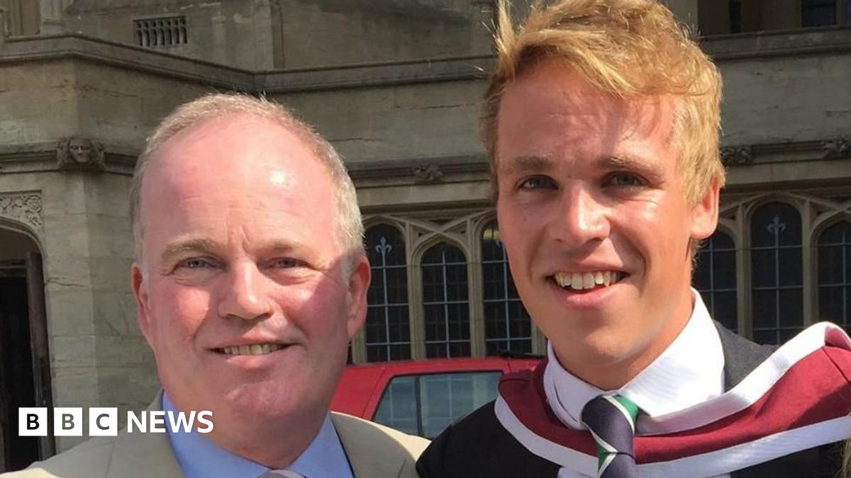 A head and shoulders image of Nick Apperley and his son Harry. They are both smiling and looking into the camera. Nick has a cream coloured jacket over a light blue shirt. Harry has a dark coloured jacket over a white shirt and a navy and green tie.