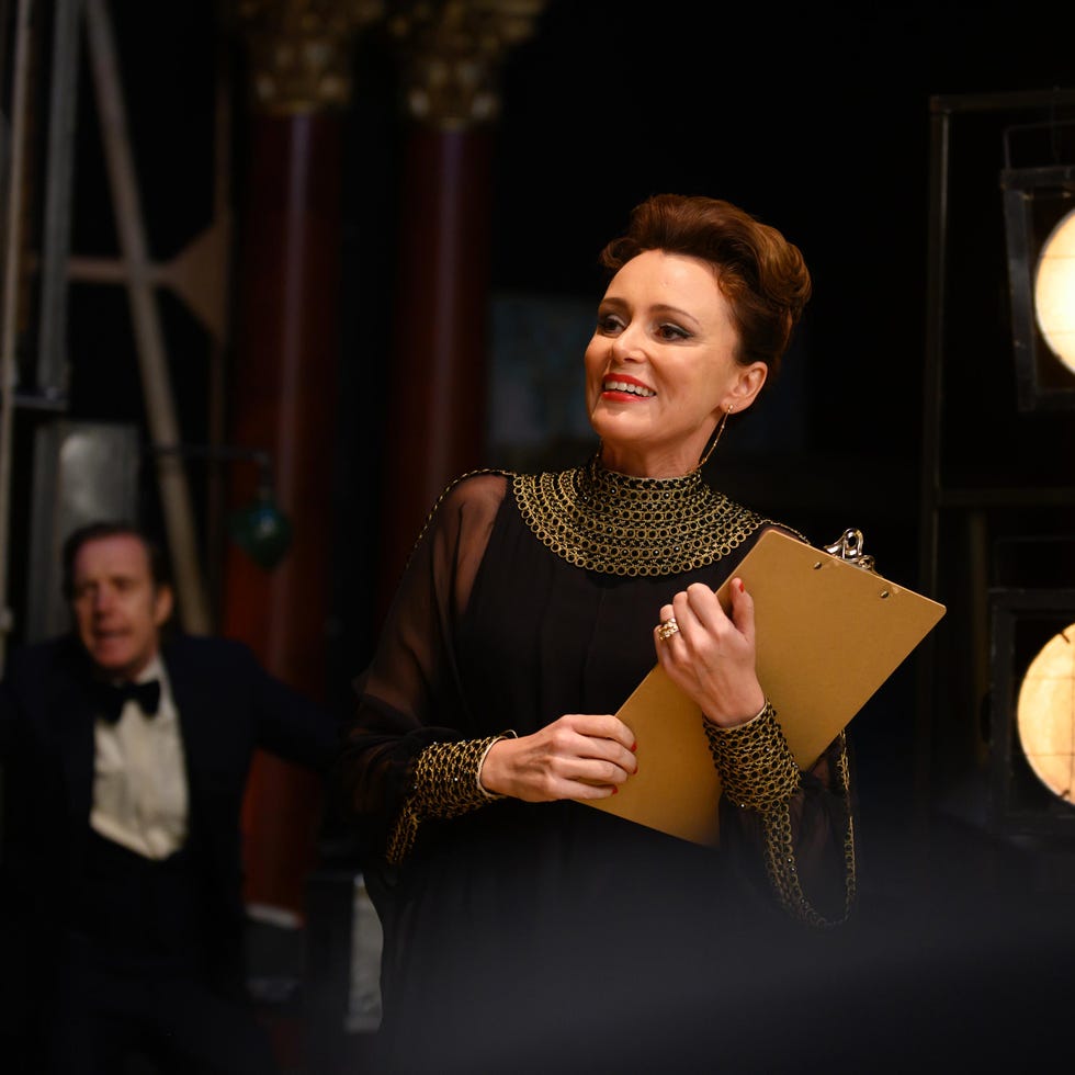 person holding a clipboard on a film set