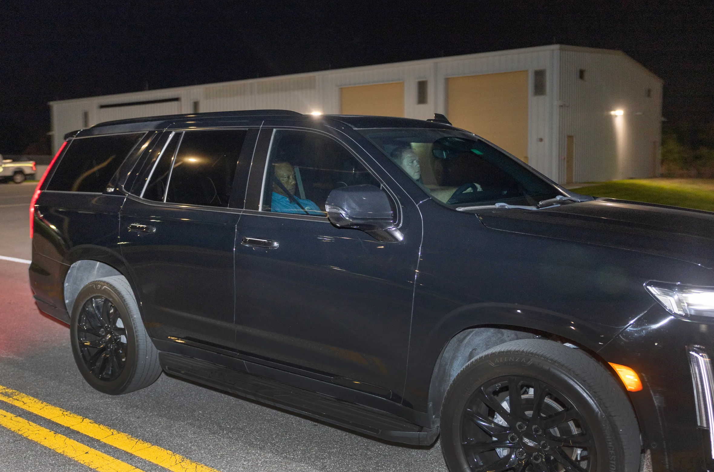 Tiger Woods is driven from Martin County Jail in a black SUV.