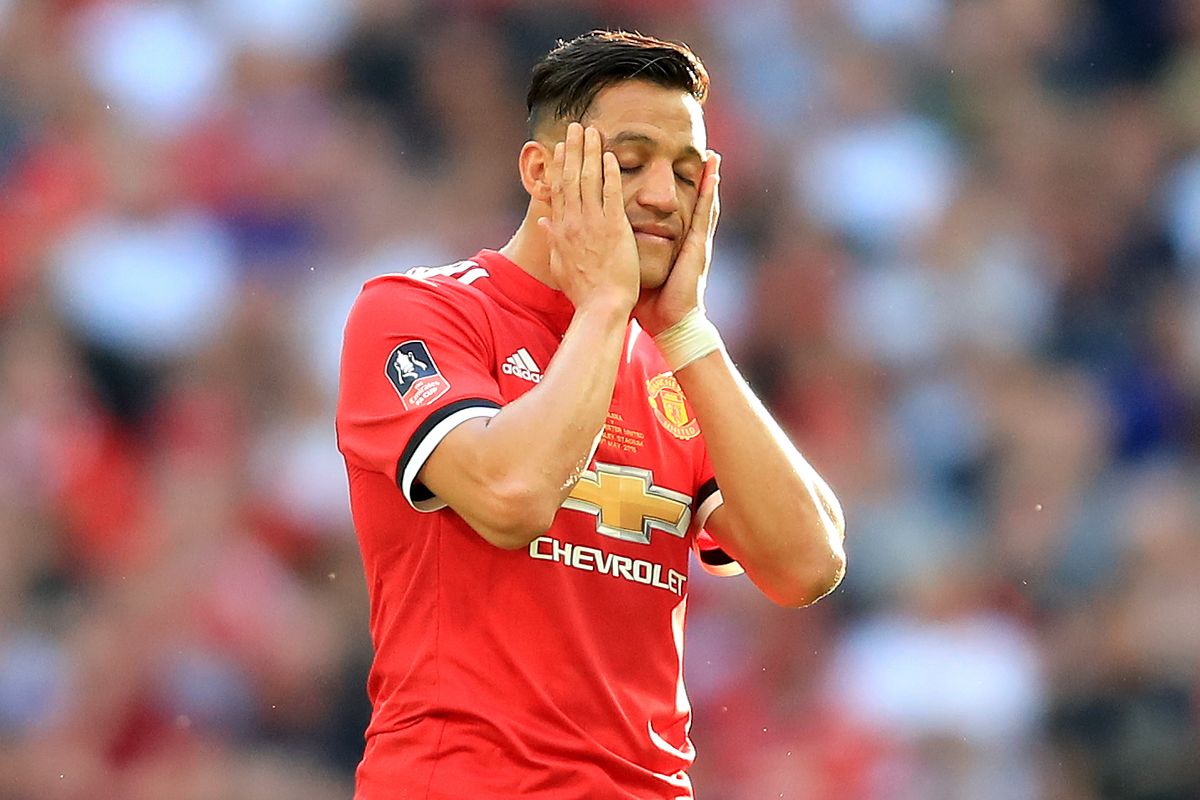 A dejected Alexis Sanchez of Man Utd holds his head in his hands during the Emirates FA Cup Final between Chelsea and Manchester United at Wembley Stadium on May 19, 2018 in London, England.