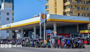 Motorists wait in a queue to refuel their vehicles at a filling station in Wellawatte on the outskirts of Colombo