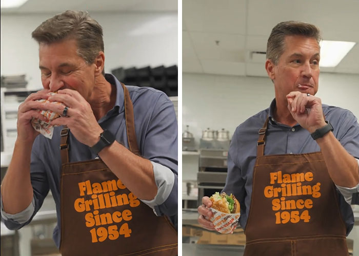 Burger King boss biting into a Whopper, wearing apron with Flame Grilling Since 1954 in a kitchen setting. Burger King boss biting into a Whopper, wearing apron with Flame Grilling Since 1954 in a kitchen setting.