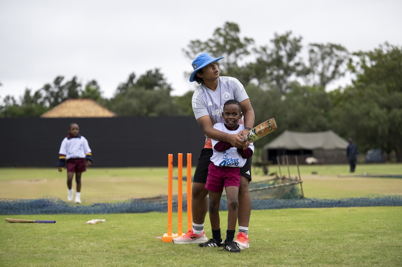Here's the manual, now tear it up: Sooryavanshi coaches a local child at the India Cricket4Good clinic in Bulawayo during this year's U19 World Cup Here's the manual, now tear it up: Sooryavanshi coaches a local child at the India Cricket4Good clinic in Bulawayo during this year's U19 World Cup