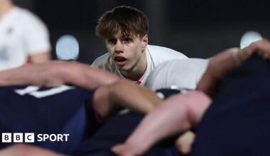 Lucas Friday kicking the ball against Scotland