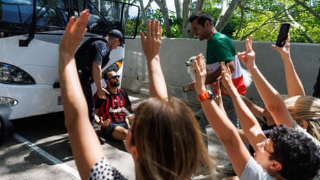 Protesters try to block bus as Iranian women's football team depart Gold Coast hotel – video
