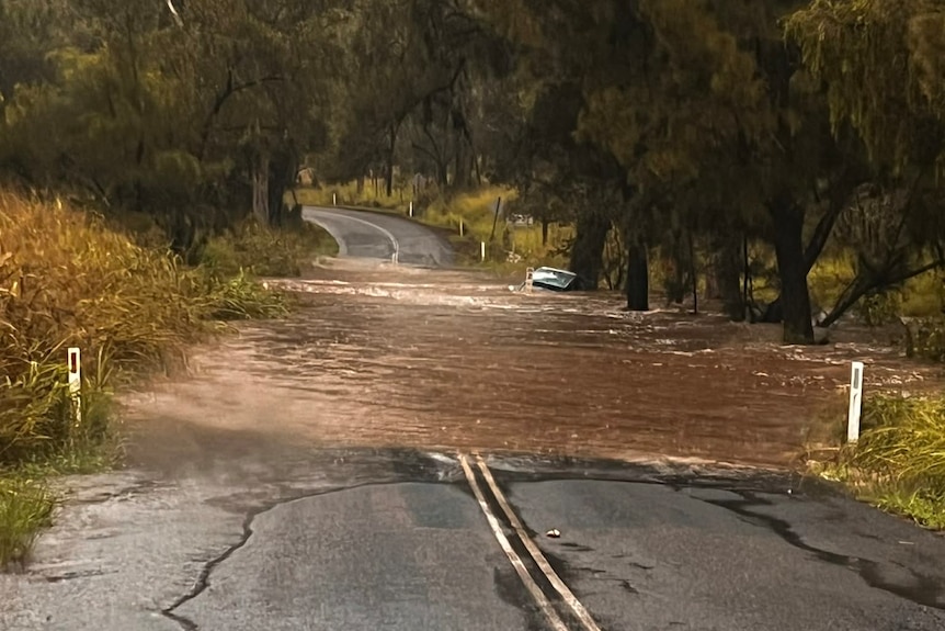Brown water over the road.