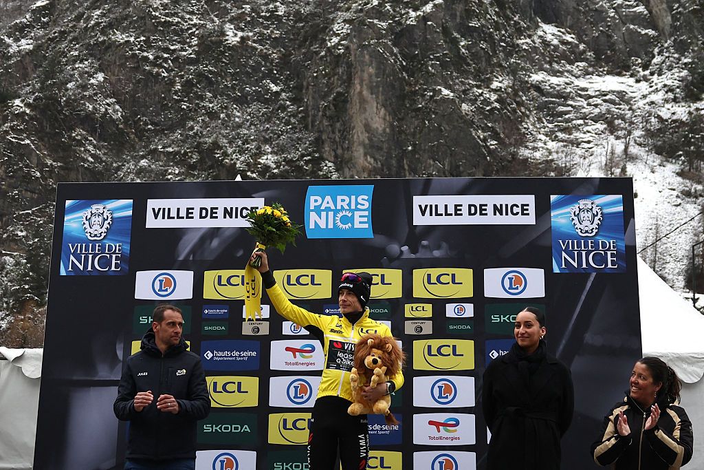 Team Visma - Lease a Bike's Danish rider Jonas Vingegaard celebrates his overall leader yellow jersey on the podium after the 7th stage of the Paris-Nice cycling race, 47 km between Le Broc and Isola-Village, on March 14, 2026. Due to deteriorating weather conditions, the route of stage 7 has been changed to a 47 km race from Le Broc to Isola. (Photo by Anne-Christine POUJOULAT / AFP)