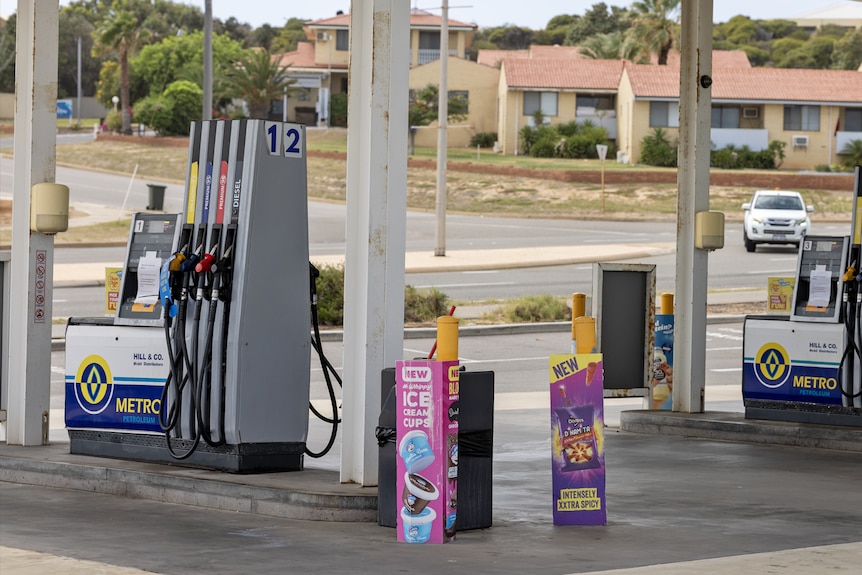 Service station has closed fuel pumps.