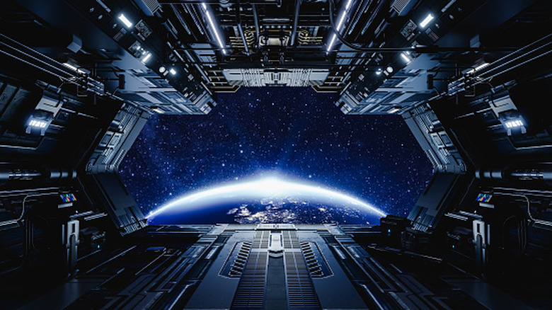 Futuristic spaceship near Earth.