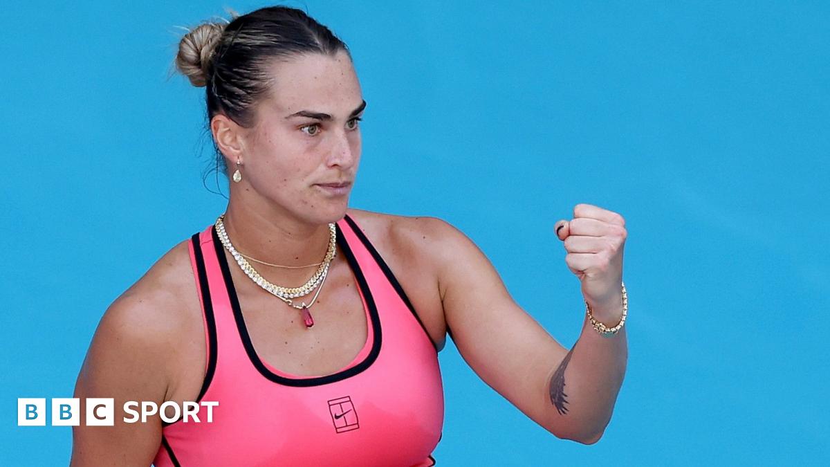 Aryna Sabalenka celebrates winning a point with a clenched fist