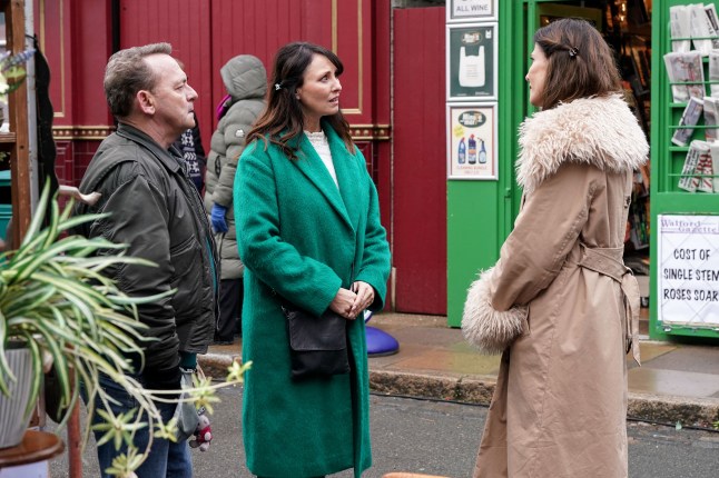 Billy and Honey Mitchell talking with Bea Pollard outside the Queen Vic in EastEnders.