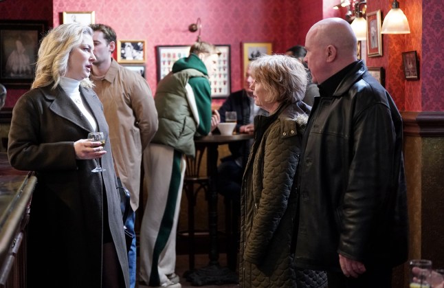 Clare speaks to Julie and Phil in the pub in EastEnders
