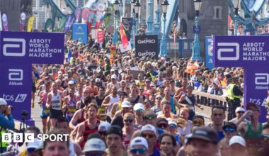 Thousands of runners pass across Tower Bridge during the London Marathon 2025