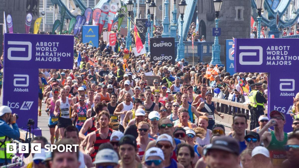 Thousands of runners pass across Tower Bridge during the London Marathon 2025